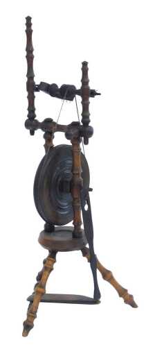 A hardwood spinning wheel, on turned supports, 88cm high.