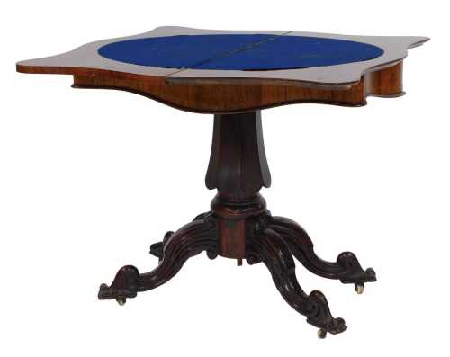 A Victorian rosewood serpentine fronted card table, the hinged top enclosing a blue baize lined interior, on a panelled column on carved cabriole legs, 74cm high, 82cm wide, 43cm deep.