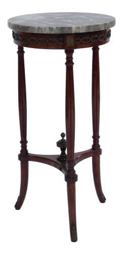 A French style mahogany occasional table, with a grey and white circular marble top with gilt metal mounts to border, raised on cylindrical reeded legs, with stretcher, surmounted by urn shaped finial, 70cm high, the top 35cm diameter.