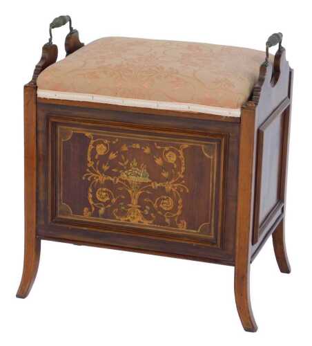 A Victorian mahogany and marquetry piano stool, the overstuffed hinged seat enclosing recesses for sheet music, flanked by two cast brass handles, the front decorated with a panel depicting flowers in baskets, surrounded by scrolling floral motifs, on out