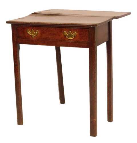 An 18thC oak tea table, the rectangular fold over top above a frieze drawer, on square legs, 69cm high, 60cm wide, 30cm deep, 60cm when extended.