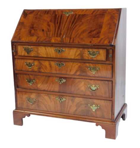 A George IIi flame mahogany bureau, the fall enclosing an arrangement of recess and drawers, the base with four drawers, on bracket feet, later veneers, etc, 114cm high, 92cm wide, 48cm deep.