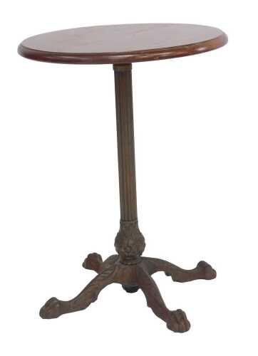 An early 20thC mahogany and cast iron pub table, the circular mahogany top raised on a reeded cast iron column, with lower floral leaf decoration, on lion paw feet, 60cm high, the top 46cm diameter.