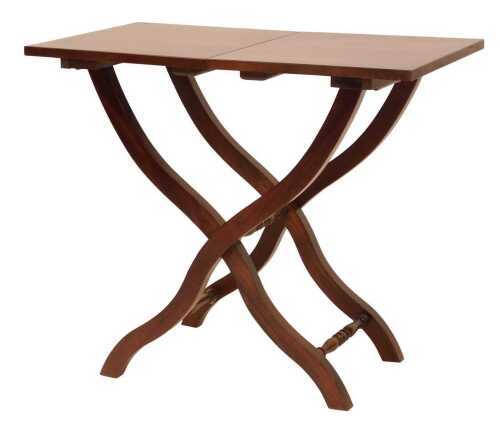 A 20thC Indonesian hardwood mahogany coaching table, rectangular top on X shaped supports and turned stretchers, 70cm high, 66cm wide, 46cm deep.