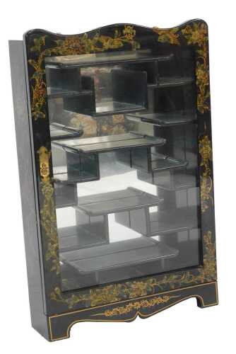 An Oriental black lacquer hanging display cabinet, the glazed door decorated with hand painted birds and flowers enclosing an arrangement of shelves, 90cm high, 58cm wide, 16cm deep.