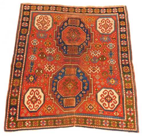 A Qashqui rug, red ground, decorated centrally with multiple medallions, within one wide and multiple narrow borders, 166cm x 166cm.