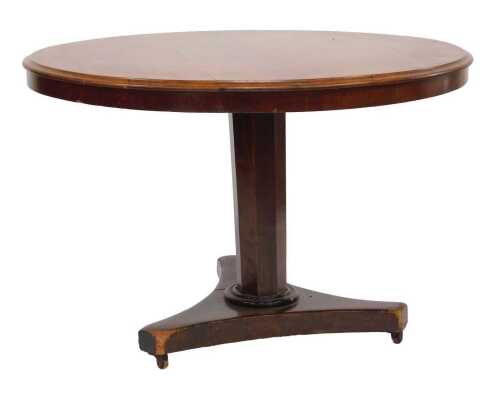 A Victorian mahogany and oak tilt-top breakfast table, the circular top raised on an octagonal column, above a trefoil base, on castors, 70cm high, 106cm wide.