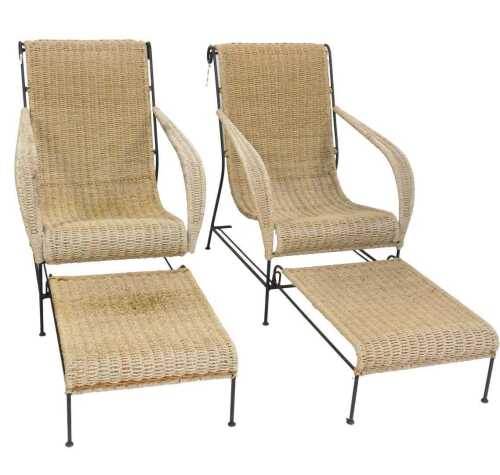 A pair of wrought iron and seagrass steamer type chairs, with foot rest.