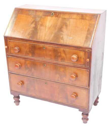 A Victorian mahogany bureau, the fall enclosing two drawers and various recesses above three graduated drawers, on turned cylindrical feet, 110cm high, 88cm wide, 44cm deep.
