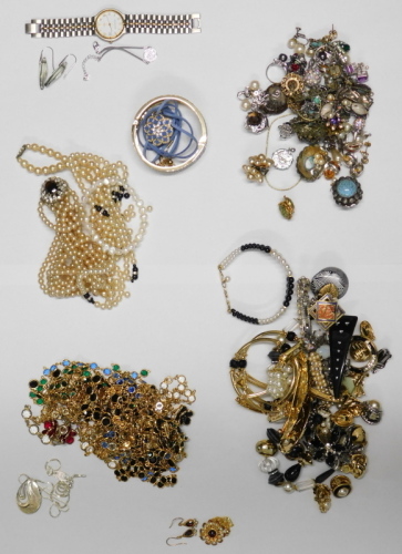 A group of assorted costume jewellery,&nbsp;comprising cultured pearl necklace with 9ct clasp, clip on earrings, bangles, faux pearl necklaces, crystal longuards, Swarovski crystal pendant and chain, Newbridge silver pendant and chain, Mappin and Webb wristwat