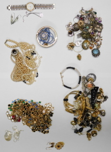 A group of assorted costume jewellery,&nbsp;comprising cultured pearl necklace with 9ct clasp, clip on earrings, bangles, faux pearl necklaces, crystal longuards, Swarovski crystal pendant and chain, Newbridge silver pendant and chain, Mappin and Webb wristwat