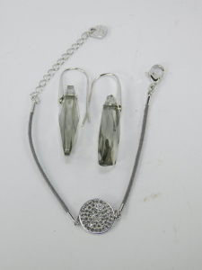 A group of assorted costume jewellery,&nbsp;comprising cultured pearl necklace with 9ct clasp, clip on earrings, bangles, faux pearl necklaces, crystal longuards, Swarovski crystal pendant and chain, Newbridge silver pendant and chain, Mappin and Webb wristwat - 5