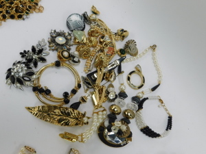 A group of assorted costume jewellery,&nbsp;comprising cultured pearl necklace with 9ct clasp, clip on earrings, bangles, faux pearl necklaces, crystal longuards, Swarovski crystal pendant and chain, Newbridge silver pendant and chain, Mappin and Webb wristwat - 11