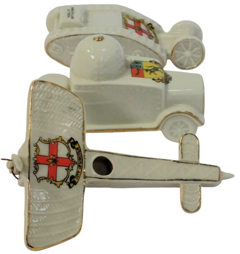 Three items of military related crested ware, comprising a City of London bi-plane, model of a British tank, and an Ancient Arms of Louth armoured vehicle.