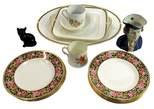 A Royal Doulton Clio pattern part dinner service, comprising oval serving dish, sandwich plate and eight side plates, together with a Goebel figure of a black cat, commemorative mugs, etc. (1 tray)