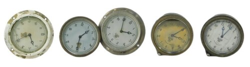 Five Smiths car clock dials and movements, each with an Arabic numeral dial, the largest 8cm diameter.