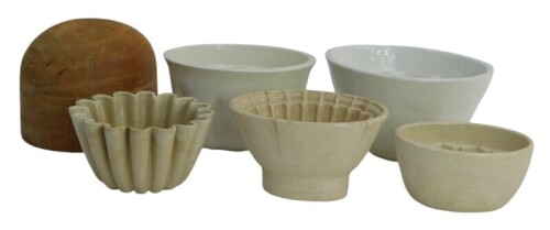 A group of 19thC and later pottery jelly moulds, together with a milliner's hat mould.