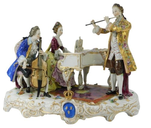 A Dresden porcelain figure group, titled The Music Lesson, bearing Dresden blue mark, 38cm high, 44cm wide.