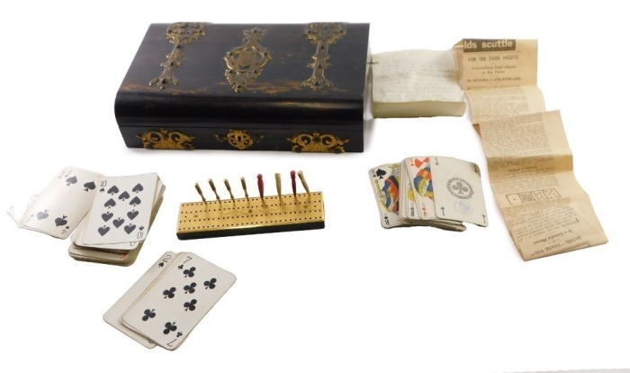 A Victorian coromandel wood and brass bound games box, with studded, pierced and engraved strap banding, engraved monogram cartouche, the hinged lid opening to reveal a fitted interior with blue moire silk lining, and having compartments for cards, and a 