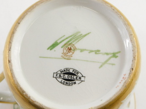 A Moorcroft Macintyre tyg vase, of slightly flared design with three stylised handles, having gilt outlines, the body decorated with tube lined floral swags in blue, and with flower head motifs in gilt, with gilt border, signed to the base and with mark f - 3