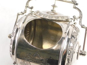 A late Victorian EPBM biscuit barrel, by Phillip Ashbury & Sons of Sheffield, number 1271, with barrel shaped body with highly decorative cut and chased decoration, and with combination lid and swing handle, raised on four leaf capped scrolling feet, 23cm - 2