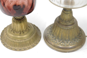 Two Victorian brass table lamps, with Duplex burners, and glass reservoirs, one with an acid etched shade, and fitted for electricity, and a brass oil lamp, with opaque white shade, and two small chamber oil lamps, with glass reservoirs and handles. (5) - 2