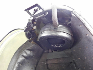 A Military aviators helmet, 22c, mark 4A/4, size medium, with headphones, and visor. - 4