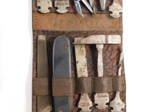 A German Transa travelling tool set, cased, and travelling cutlery set with glass beaker and leather case. (2) Belonged to Col. Phiroze Bharucha DSO of the Indian Army. - 2