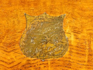 A Victorian oak veneered writing slope, with fitted interior, having blue leather gilt tooled writing pad, one ink bottle, with brass presentation cartouche with inset brass shield shaped plaque to the lid, inscribed James WM Glover from HSS, 14th August - 2