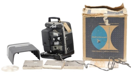 A Bell & Howell Lumina 8mm cine projector, with original box, and some film reels. WARNING! This lot contains untested or unsafe electrical items. It is supplied for scrap or re-conditioning only. TRADE ONLY