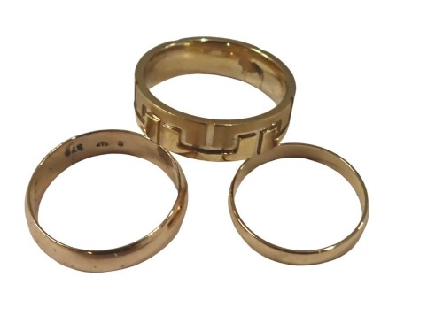Three various dress rings, comprising a 9ct gold wedding band, of plain design, 1.6g, and two further dress rings, both stamped 9kt but plated. (3)