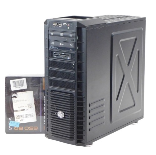 A PCSpecialist Cool Master combination tower computer and DVD player, with Evga 650BQ power unit.