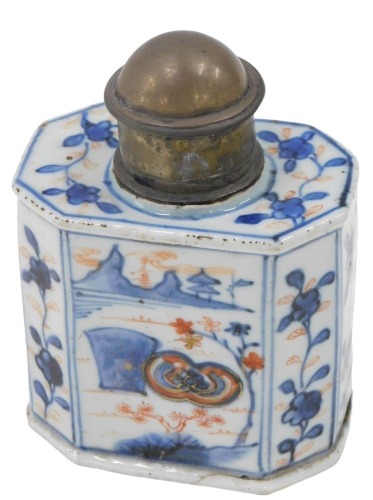 An 18thC Chinese porcelain Imari tea caddy, octagonal section form, painted with landscape and trailing flower head and foliage decoration, with replacement white metal collar and cover, 12cm high.