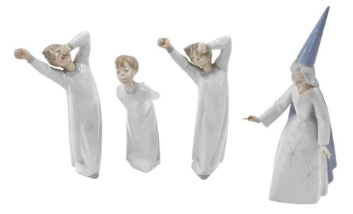 Four Lladro figures, comprising two boy awakening figures, fairy godmother, and another. (4)