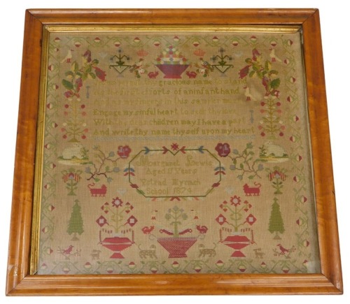 A 19thC Welsh needlework sampler, with religious text within a border of trees, shrubs, birds, and landscape vignettes, by Margaret Lewis Ystrad Mynach (Glamorgan, Wales), aged 11 years, Ystrad Mynach School 1874, 64cm x 65cm, in maple frame.