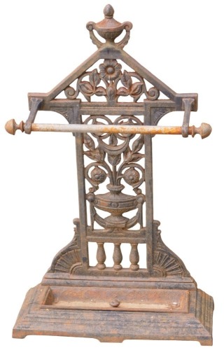 A cast umbrella stand, the floral and urnular back, on a rectangular stepped base, 80cm high, 46cm wide, 21cm deep.