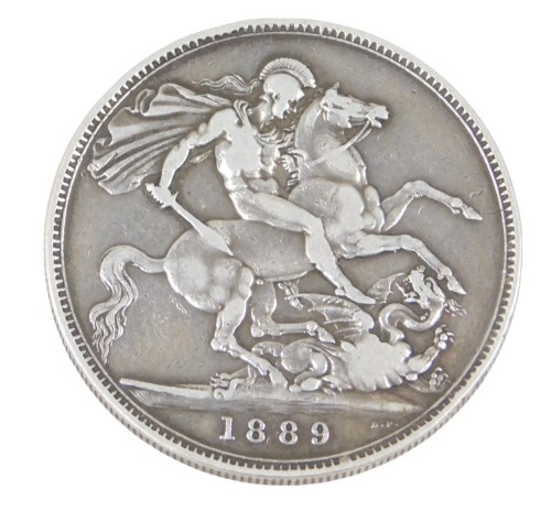 A Victorian silver crown dated 1889.