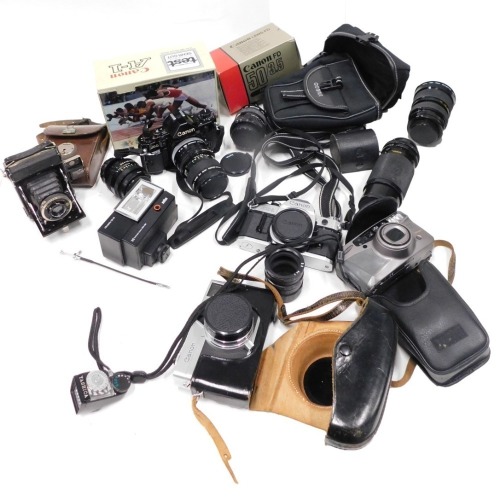 A quantity of cameras and camera equipment, comprising Canon AI, with Canon Macron lens FD 50mm, various lens caps, a SCA310 German flash, a Canon AEI camera, Canon Canonet camera, various boxes, a C/D auto lens, and 28-70 lens. (1 box)