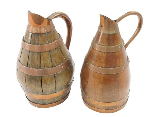 Two 20thC cooper barrelled and copper banded jugs, 26cm and 27cm high. (2)