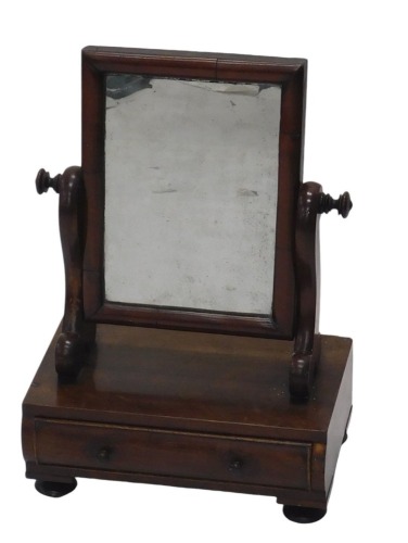 A 19thC mahogany dressing table mirror, the rectangular top on arched support, with a raised rectangular base, single drawer on bun feet, 57cm high, 38cm wide, 23cm deep.