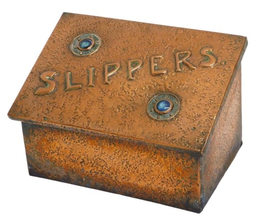 An Art Nouveau copper slippers storage box, with raised circular turquoise motifs, lined interior, 32cm high, 38cm wide, 25cm deep.