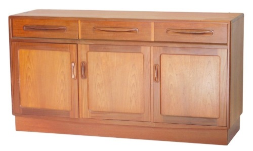 A G-Plan teak sideboard, fitted with three frieze drawers and cupboards below, enclosed by three panelled doors, with plain plinth base, 77cm high, 42cm wide, 45cm deep.