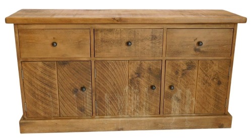 A modern sideboard of heavy pine plank construction, fitted with three drawers, and cupboards below, with plinth base, 80cm high, 150cm wide, 42cm deep.