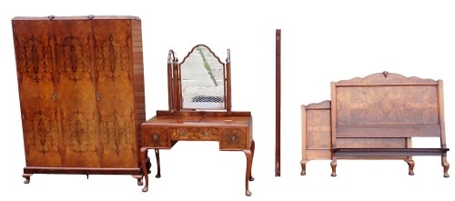 A 1930s figured walnut bedroom suite, comprising hanging wardrobe enclosed by three doors, on low cabriole legs with matching kneehole dressing table, fitted with a triple mirror, and with a single bed to match.