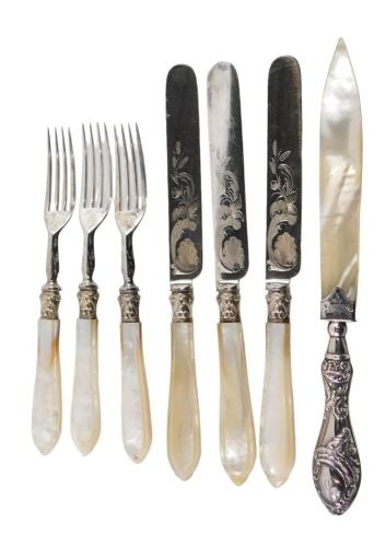 Three silver collared and mother of pearl handled fish knives and forks, and a silver handled Edward VII mother of pearl bladed letter opener.