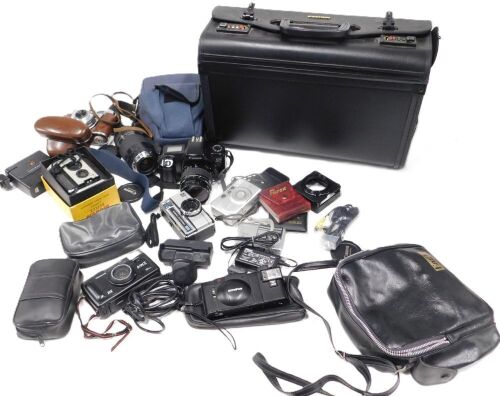 A leather briefcase and contents of cameras and camera equipment, comprising a Canon EOS 1000F camera, a Canon zoom lens 75-300mm, and a Hoya Japanese 58mm lens cap, various accessories, a Kodak Pronto LK, various cabling, Olympus digital camera, Nikon Co