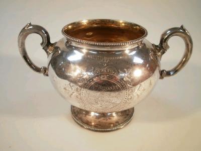 A Victorian silver two handled prize cup of squat spherical design with