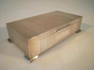 A rectangular silver table cigarette box with hinged lid