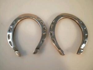 A pair of George VI silver horseshoes