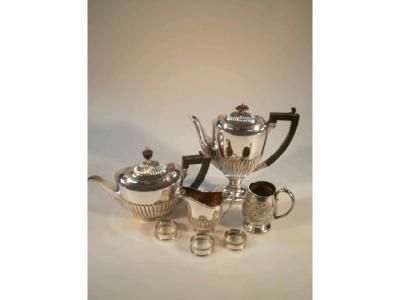 A silver plated semi fluted tea and coffee set of three pieces including milk jug